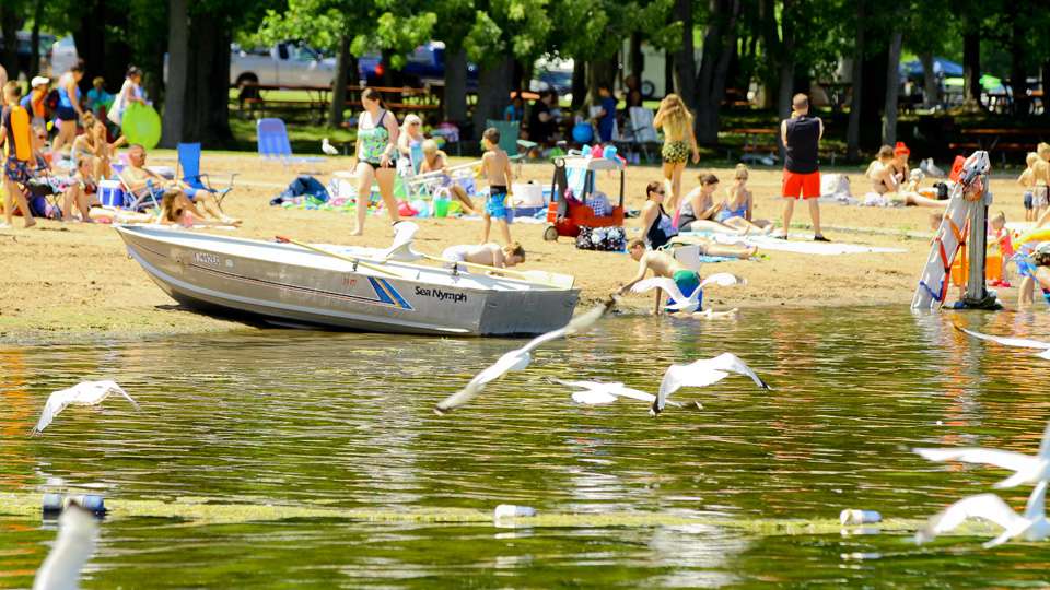 Adjacent to the docks, New Yorkers were enjoying a perfect afternoon on the beach at Oneida Shore Park. 