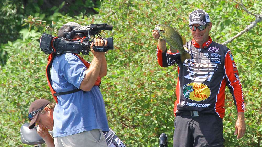 Again the smile returns, and KVD ends the morning with some confidence that he has round two in the bag. But there are storm clouds on the horizon, as Kreiger has found his fish. 