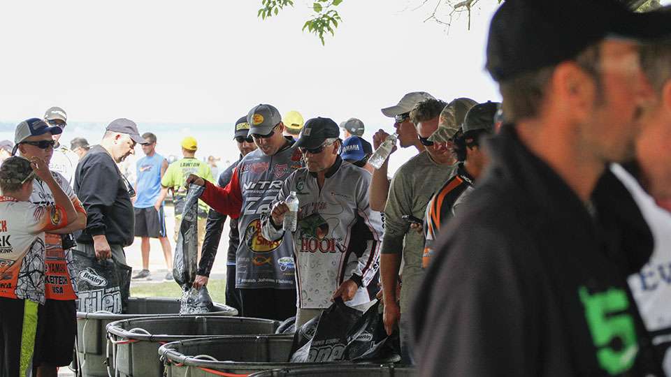 Anglers sit backstage and evaluate their days, get some water and talk with other competitors.
