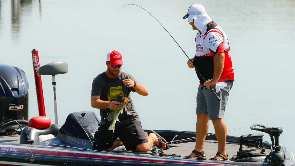 The fish made it in the boat on the 95-degree day. Because of the heat, Mark Boling added a towel to cover his neck. 