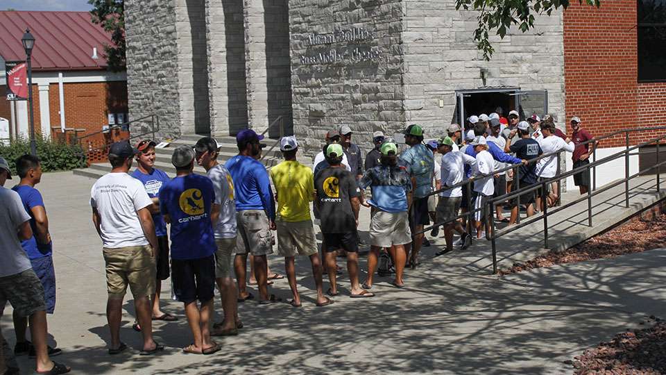 The line of anglers flows out of the registration building where teams are confirming their information and will get briefed on every rule.