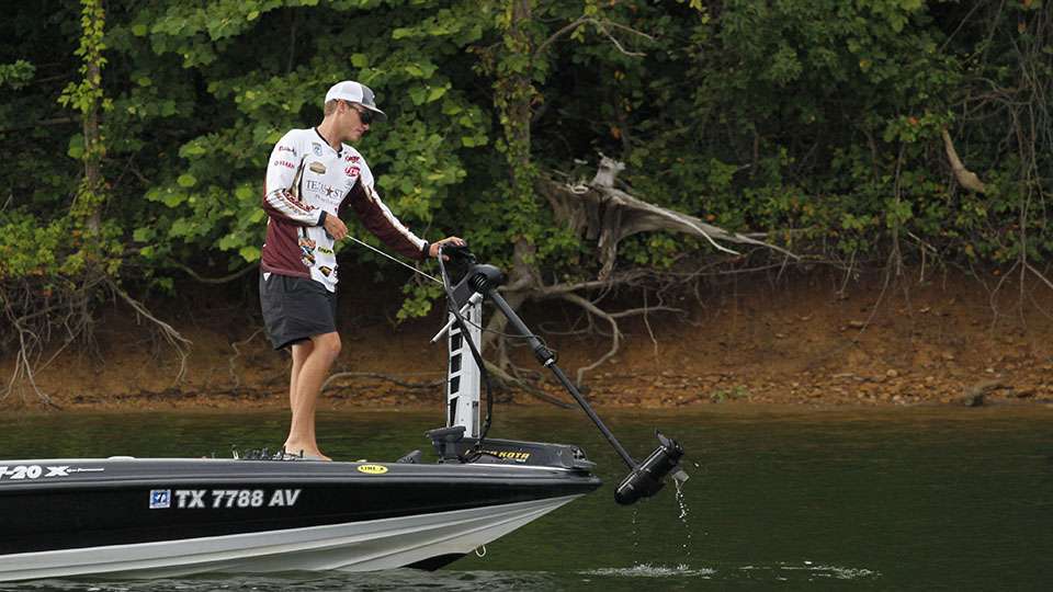 Sam Stone lifts the trolling motor as they too change spots.