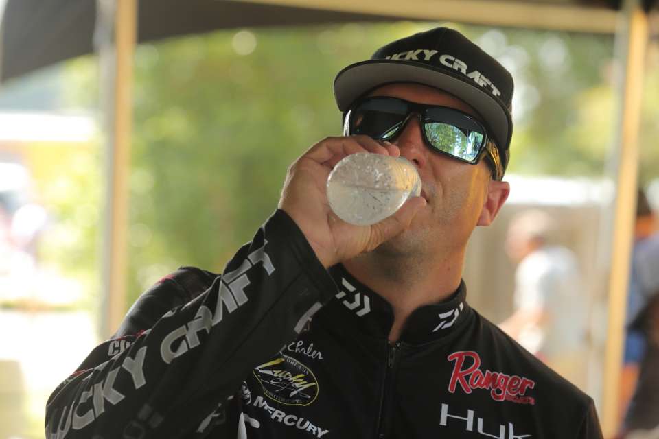 Brent Ehrler drinks water before getting up on stage.