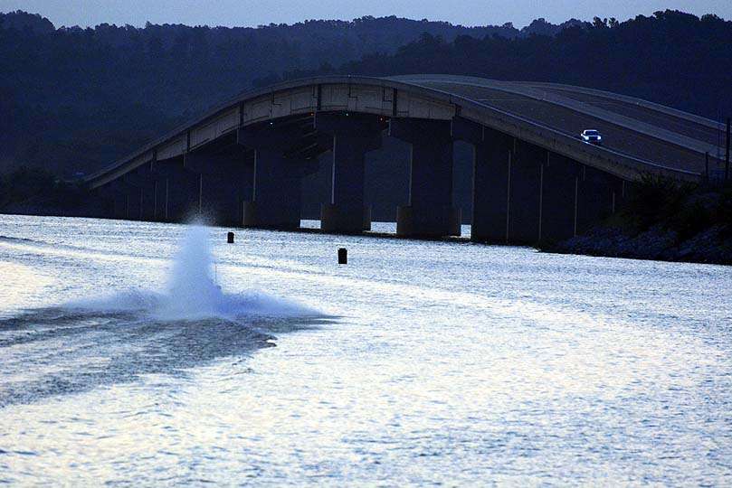 The state route 79 bridge looms in the background on Kentucky Lake. The lakeâs famous offshore ledges surround the bridge. 