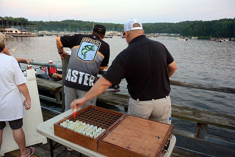 Jon Stewart, director of the B.A.S.S. Nation, hands out the floating key fobs with boat numbers. The anglers return the fobs upon checking back in to the weigh in. 