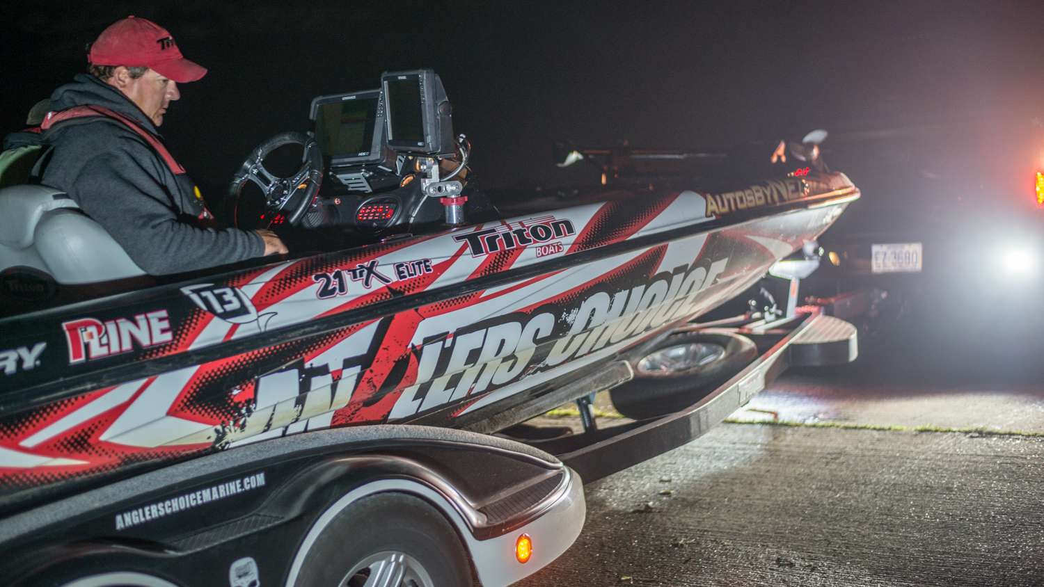 Anglers arrive at the ramp and begin to launch their boats. 