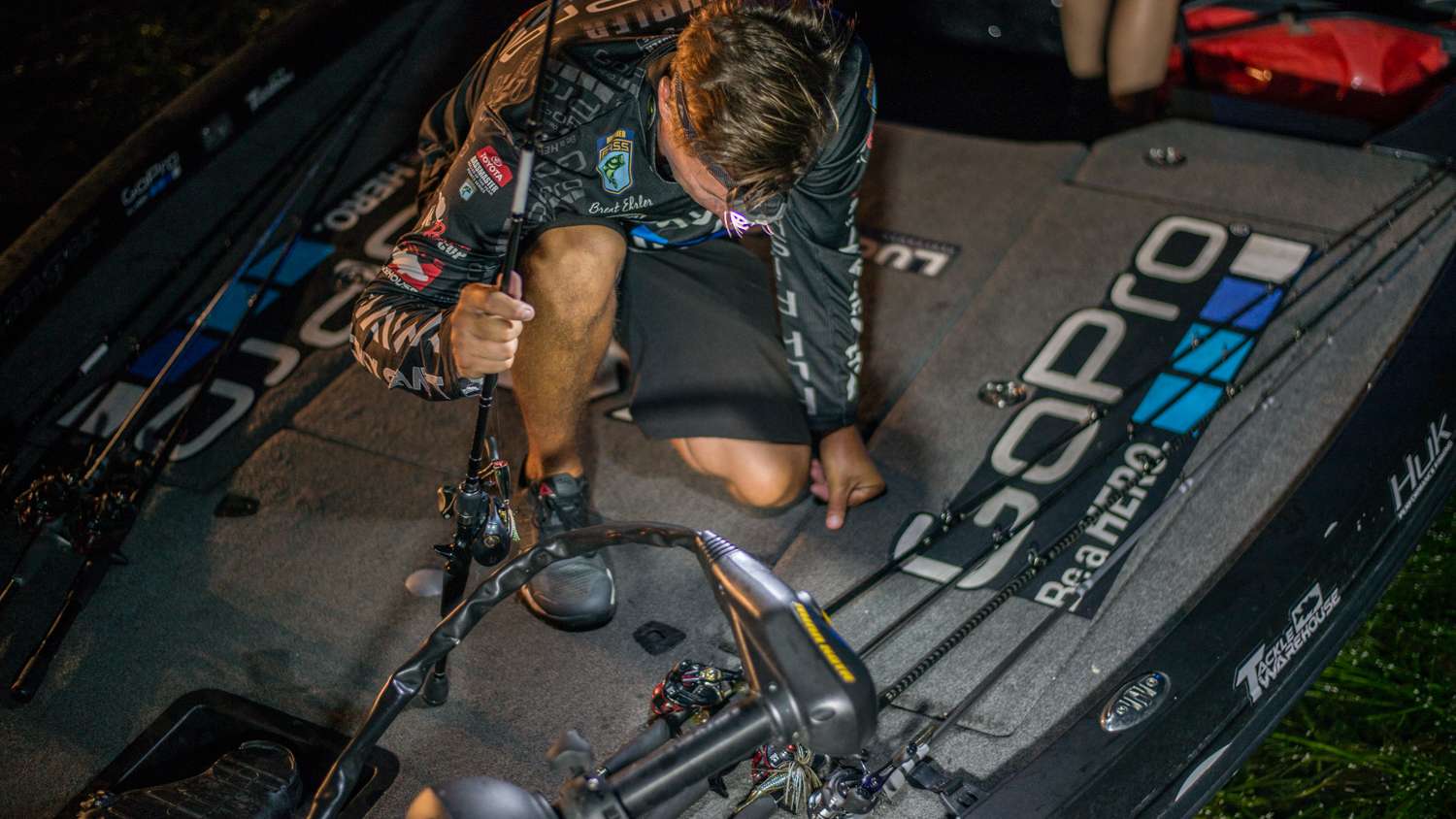Ehrler straps his rods to the deck and organizes his boat before takeoff. 