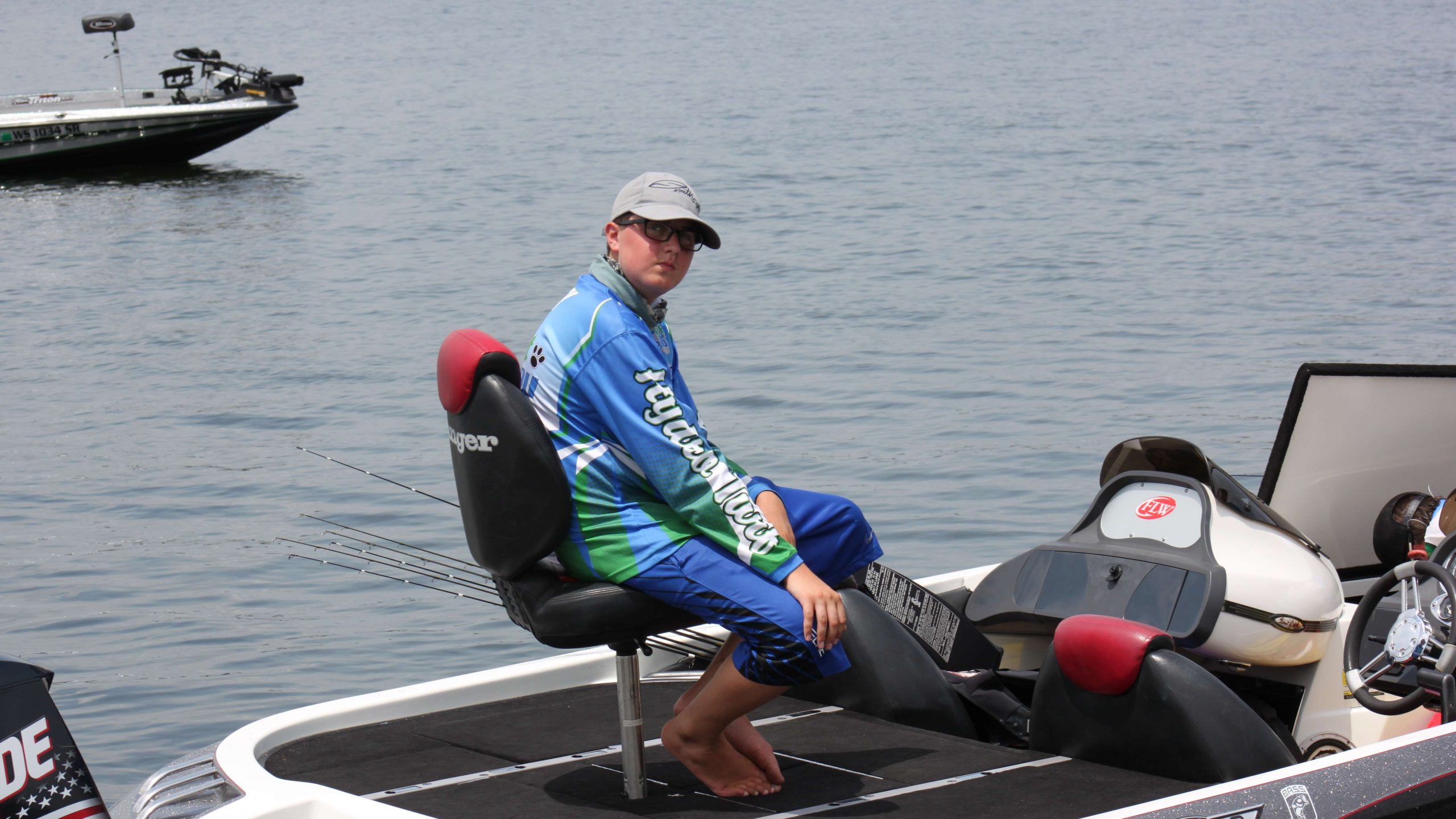 Team Michiganâs Nathan Elsey takes a load off after a long, hot day of fishing.