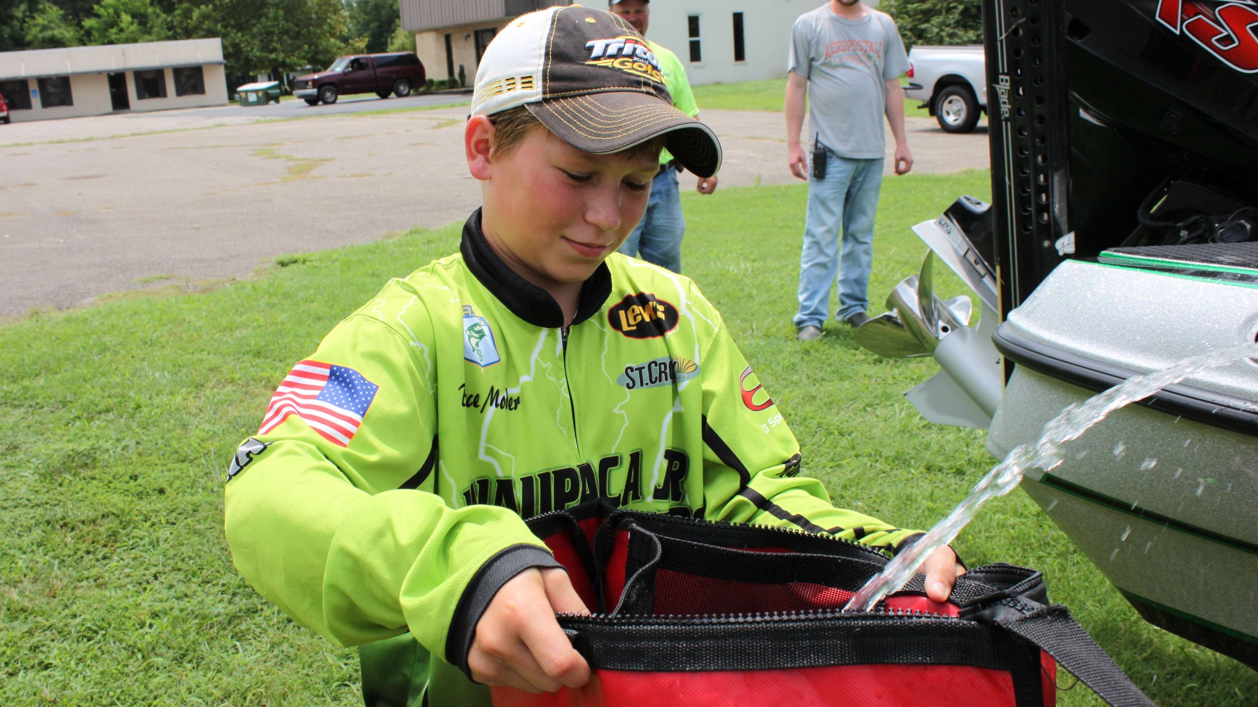 Team Wisconsinâs Bryce Moder fills his bag with bilge water before the weigh-in.