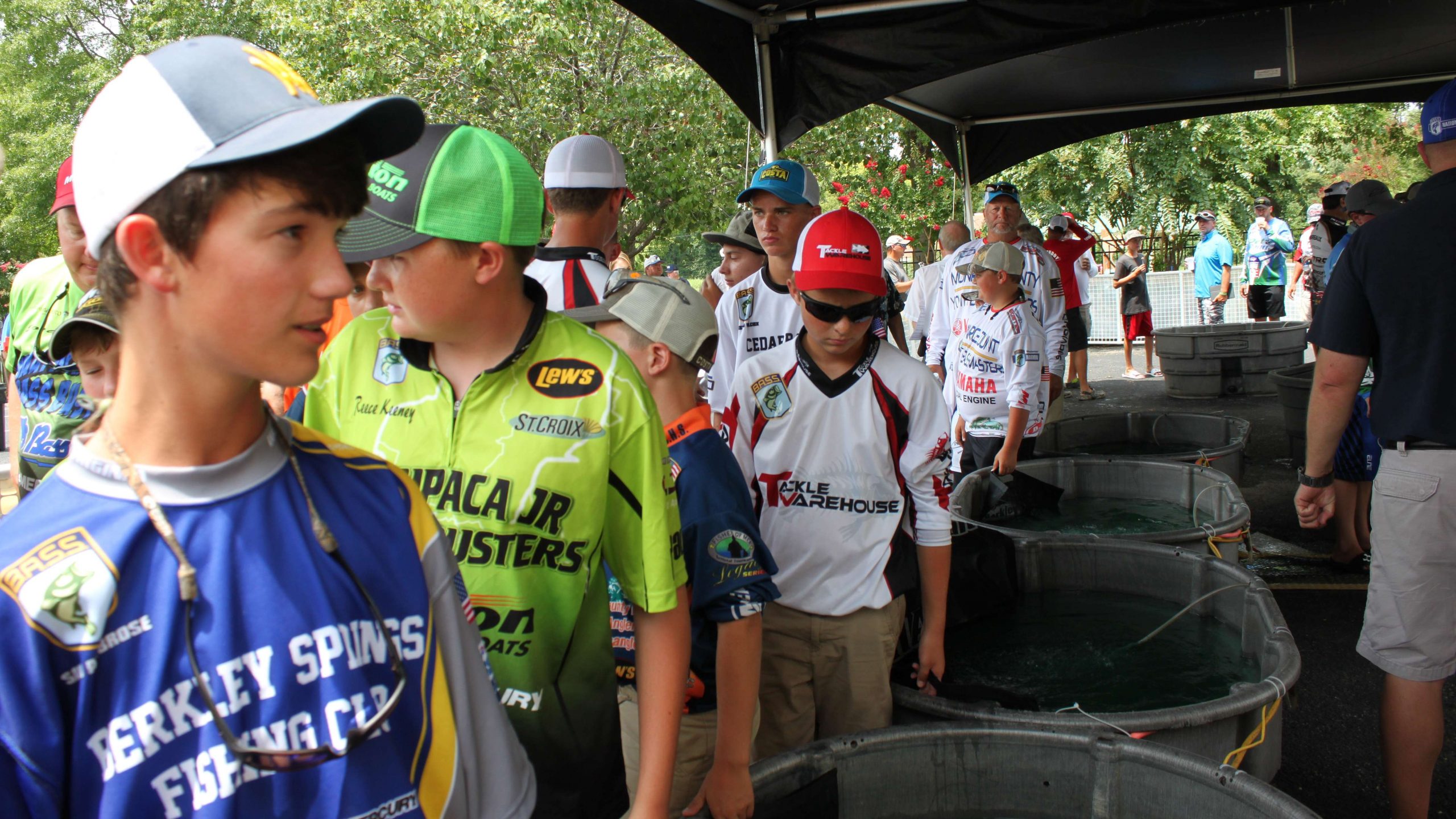 The junior anglers begin to line up at the tanks as weigh-in is about to begin.