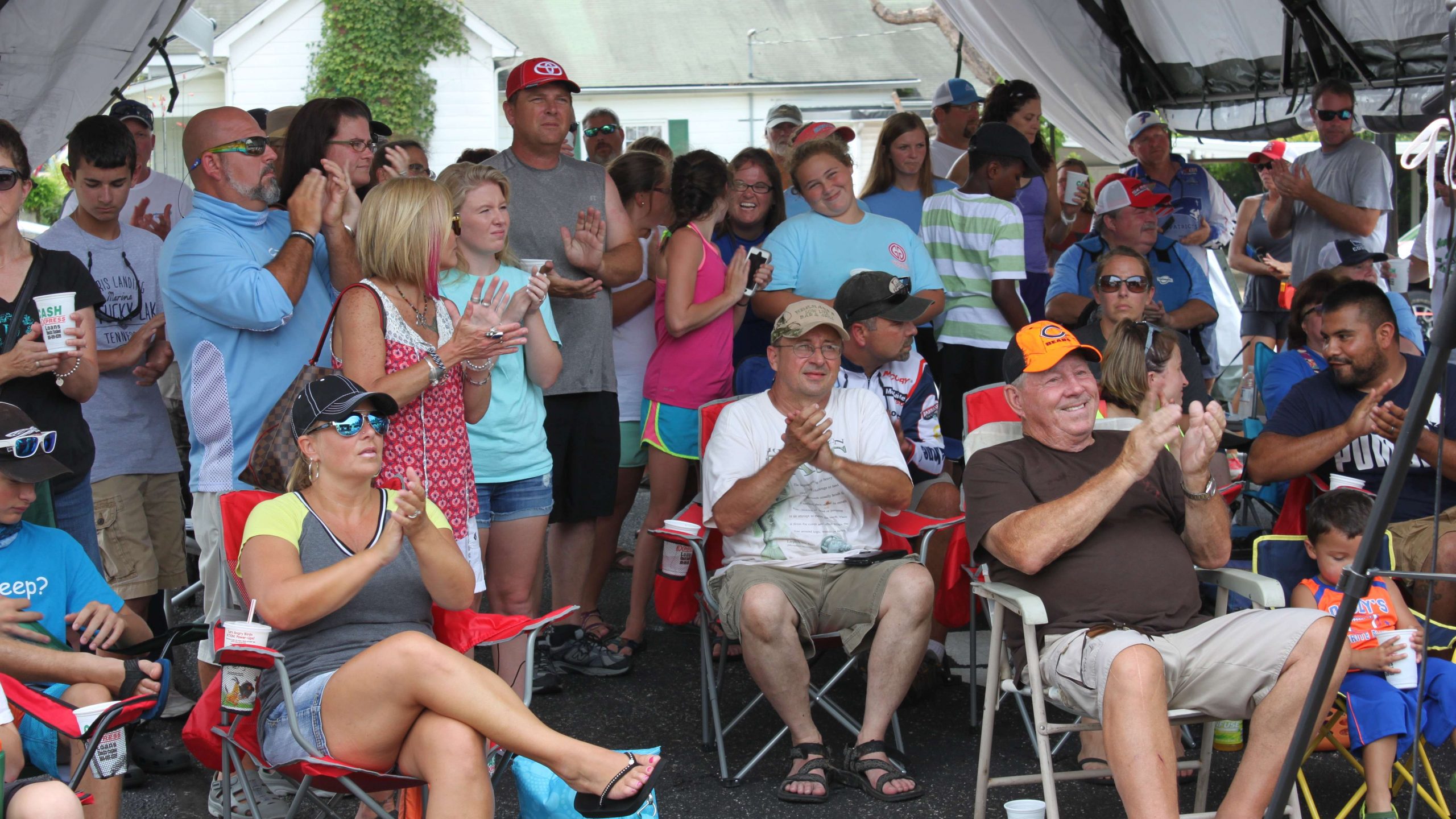 Fans applaud the young anglers as weigh-in is about to begin.