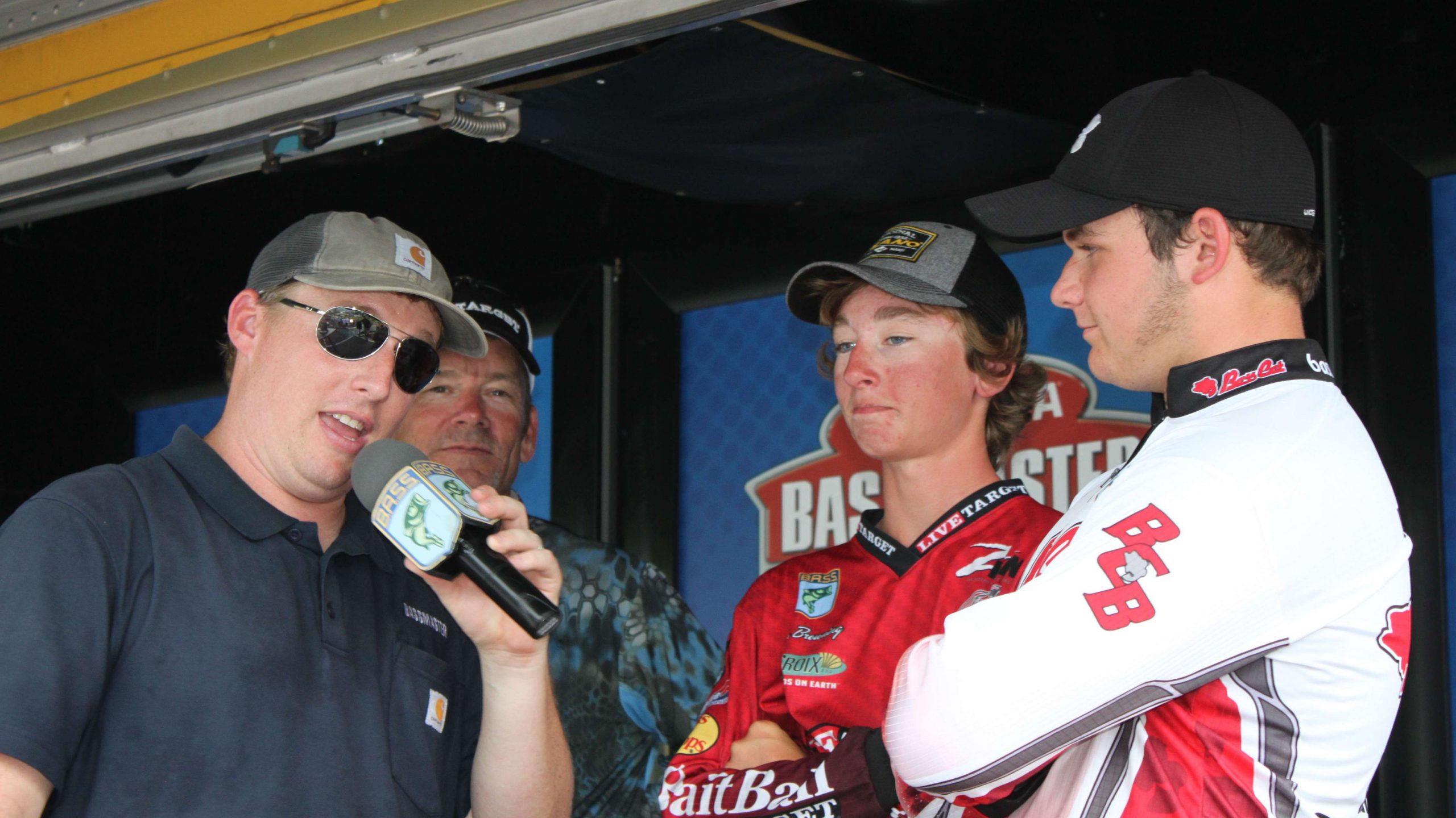 Tournament director Hank Weldon took a few minutes to interview Vereen and Browning after their catch. Bassmaster Elite Series pro Stephen Browning, who is coach for Team Arkansas, beams from behind.