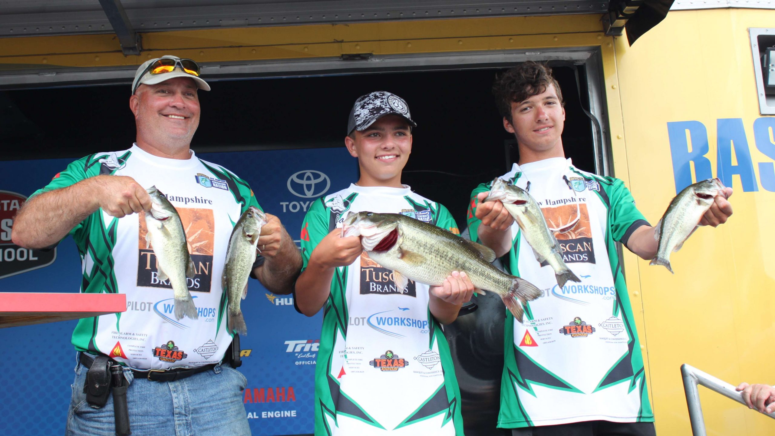 Team New Hampshire anglers Jack Armstrong and Logan Daniels fished themselves into second place on Tuesday with a five-fish limit of 7-15. Here the boys and their coach display their haul.
