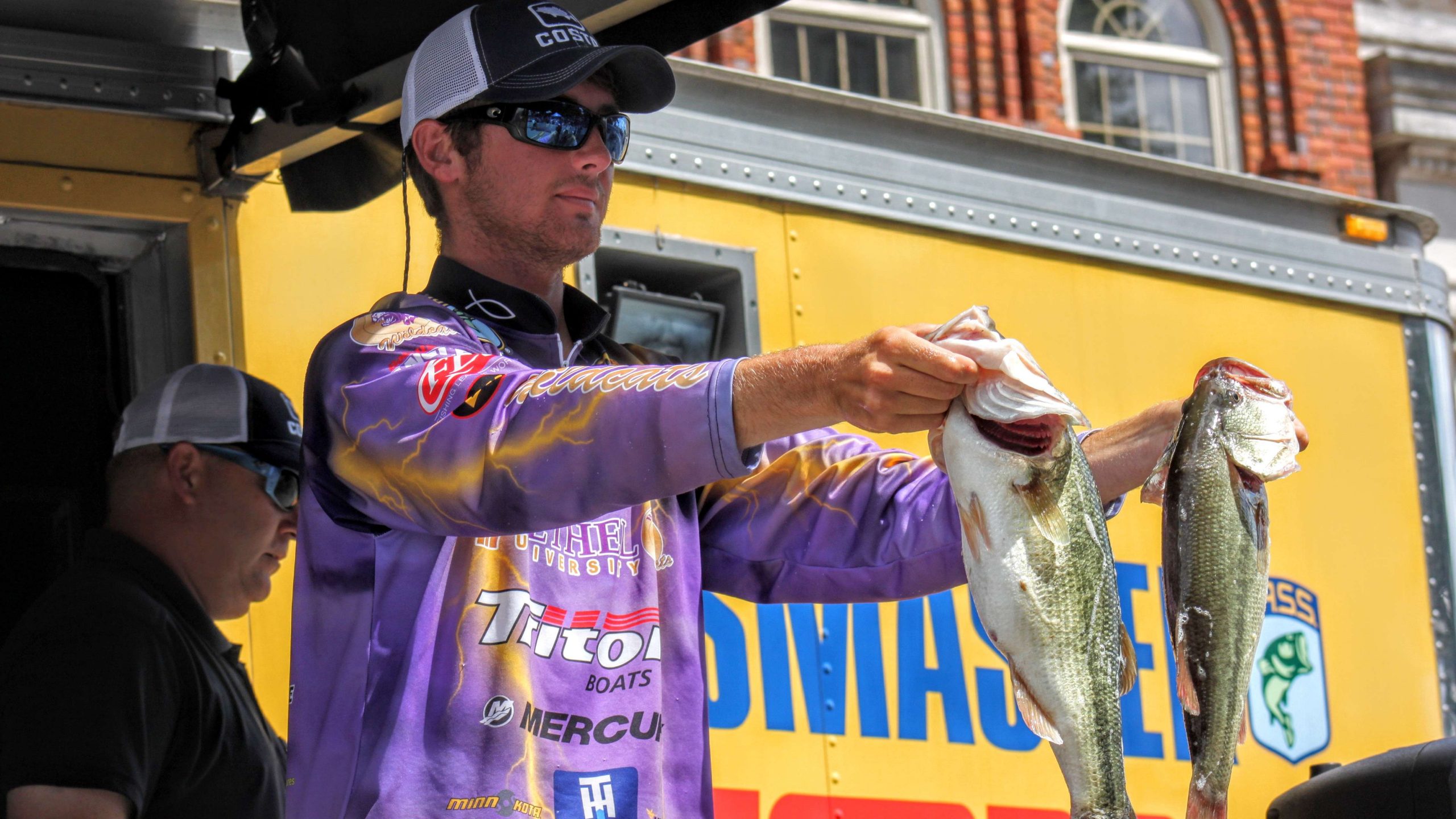 Garrett grabs hold of a couple of his Tennessee toads and displays them for the crowd.