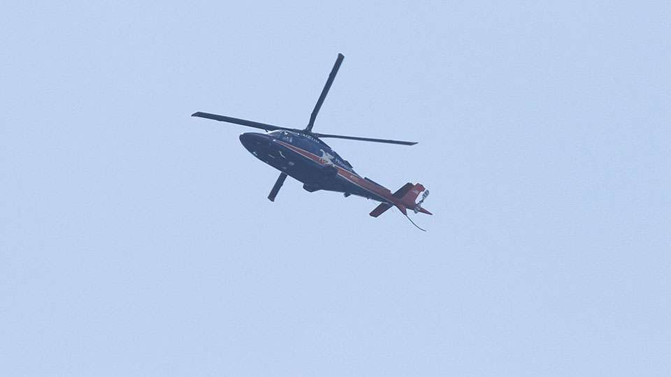 A helicopter flies overhead, which is common at the Potomac.