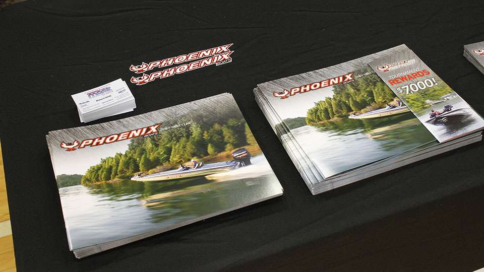 Along with hats, they also had boat brochures for all of their models set up.