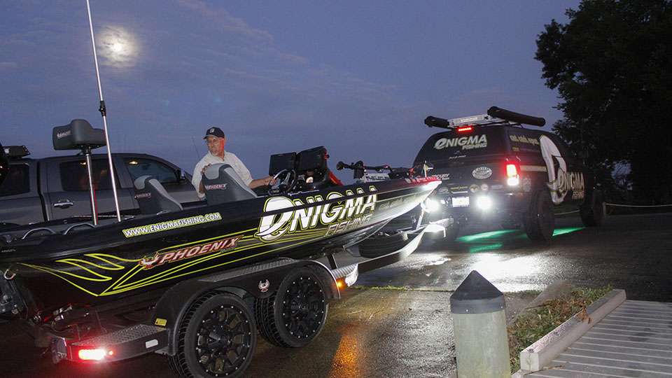 Jesse Tacoronte backs his rig down the ramp as his co-angler floats off the trailer.