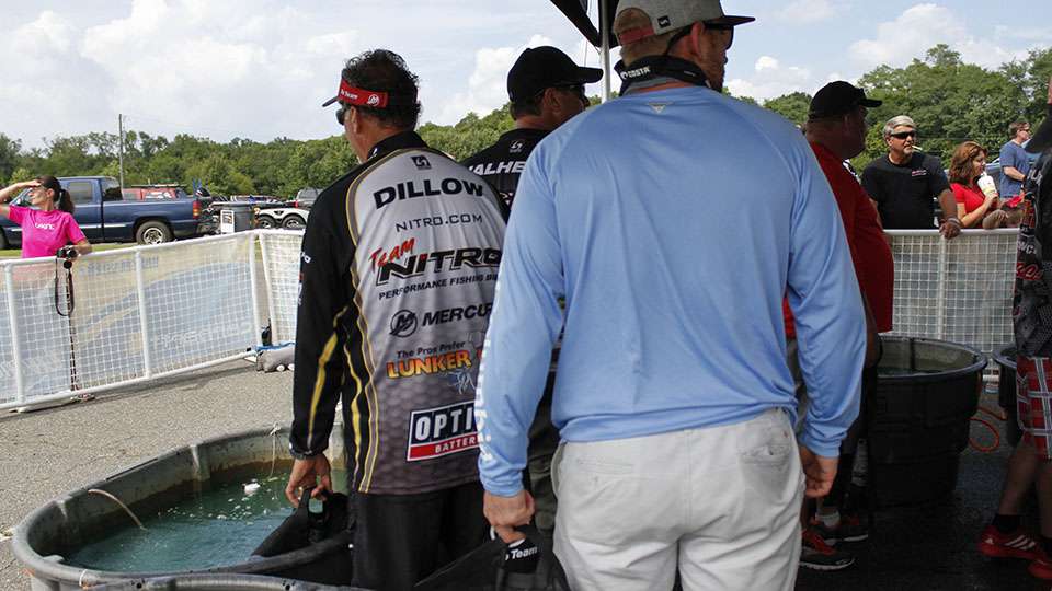 The Day 1 leader Chris Dillow waits at the tanks. He only managed two fish today and will not repeat as the James River champion, but he did make a check after falling to 30th.