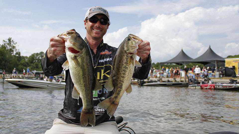 Al Farace holds up two pretty James River bass from his Day 2.