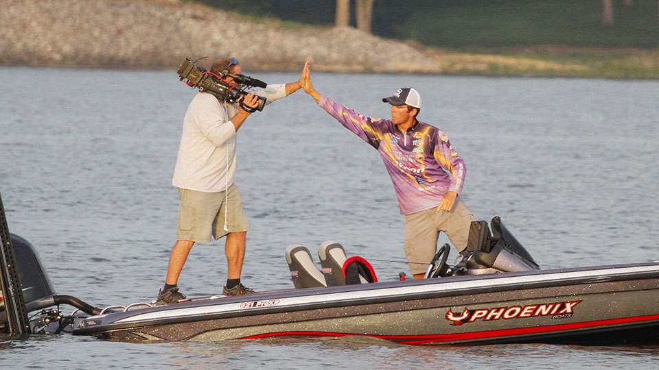 Garrett hands out a high five again as the big ones have rolled through this area it seems and he is putting in work early this morning.