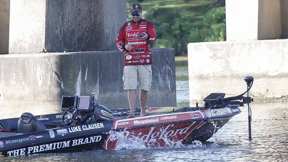 The fish thrashed at the boat as Clausen played it out hoping to keep it hooked up.