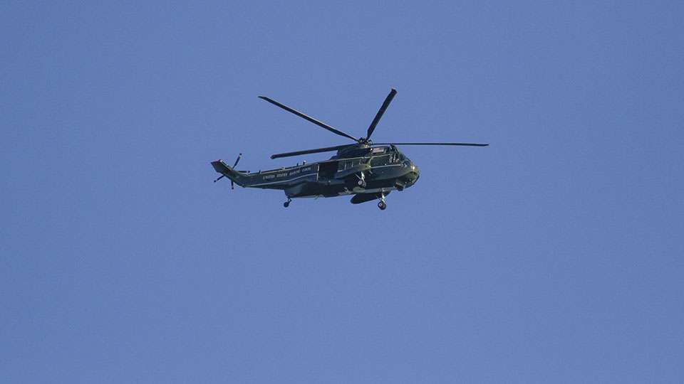 A Marine helicopter flies overhead. There is a tremendous amount of air traffic on the Potomac because of the hustle and bustle of Washington D.C.