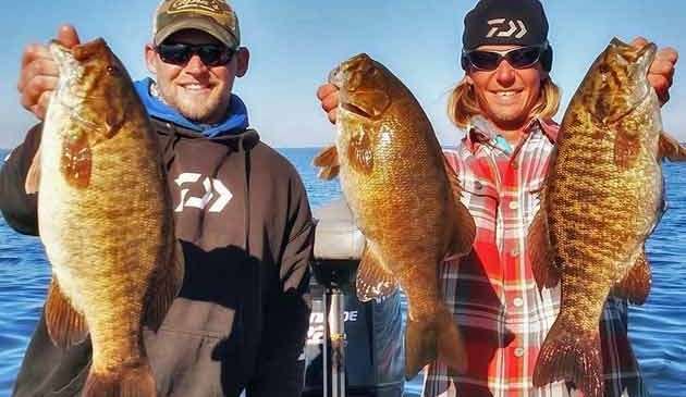 Seth Feider, who finished second last week on the Mississippi River out of La Crosse, gets another home-state fishery and one he calls his favorite. Here he and John Figi (left) show several trophy class smallmouth they caught on Mille Lacs. Feider, of Bloomington, Minn., said he believes it might take 26 pounds a day to win this week.