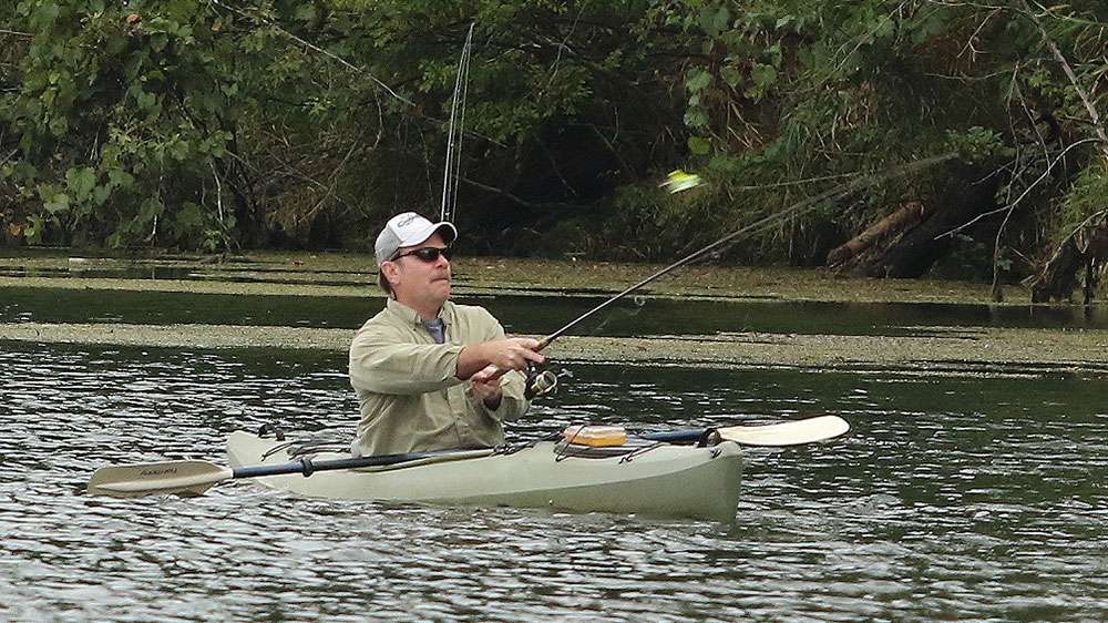 Nearby a kayak angler would fish his way past, like many of the anglers in the pond, he wasn't catching them either.