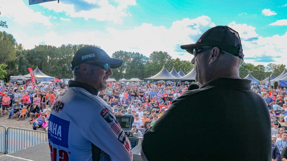 Randall Tharp talks to Dave Mercer as a sea of Wisconsin bass fishing fans hang on every word.