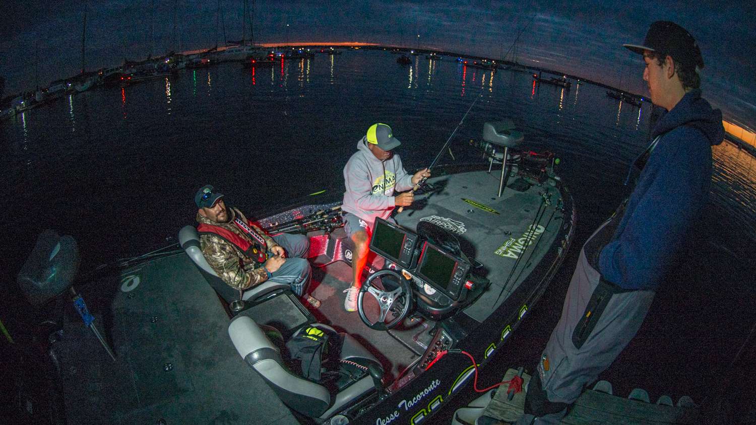 Tournament leader Jesse Tacoronte lines up as boat number one and checks his rods over while talking about yesterdays hot fishing action. 