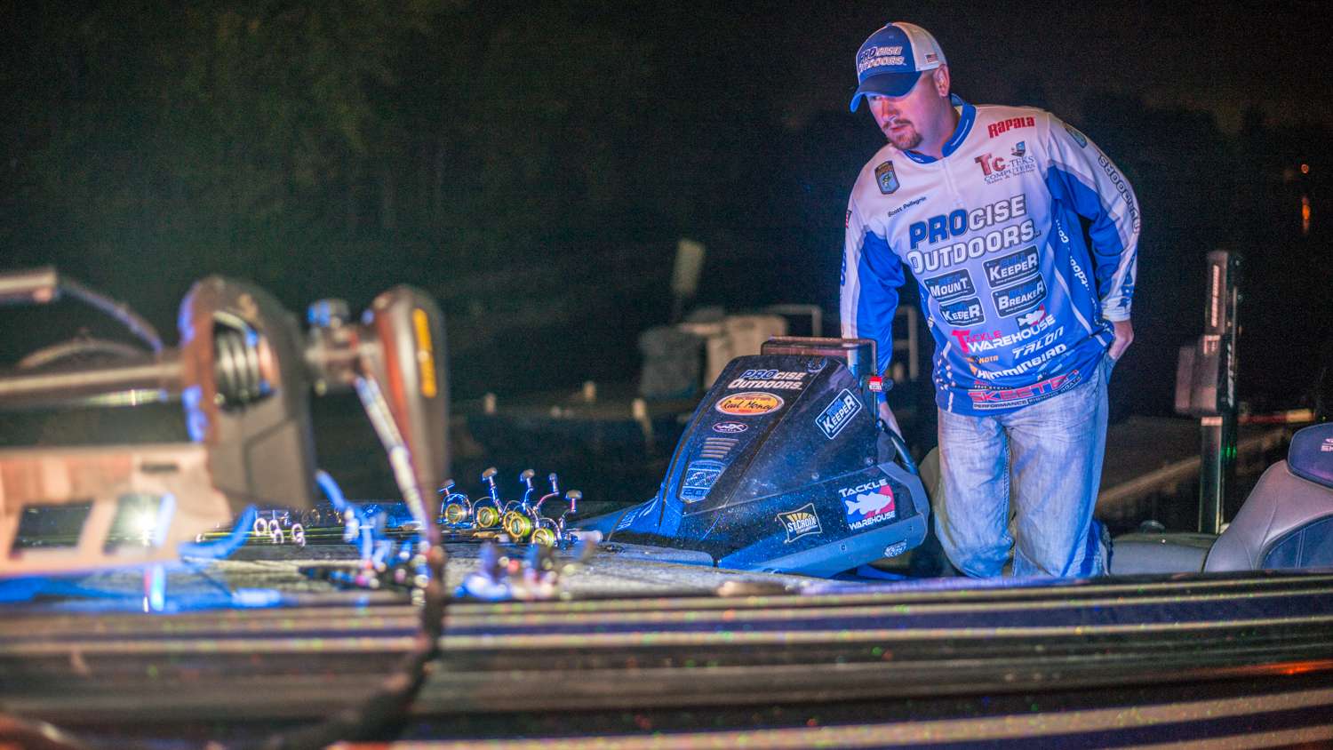 Scott Pellegrin, currently in 4th place with 19lbs 13oz, picks up his co angler and launches his boat. 
