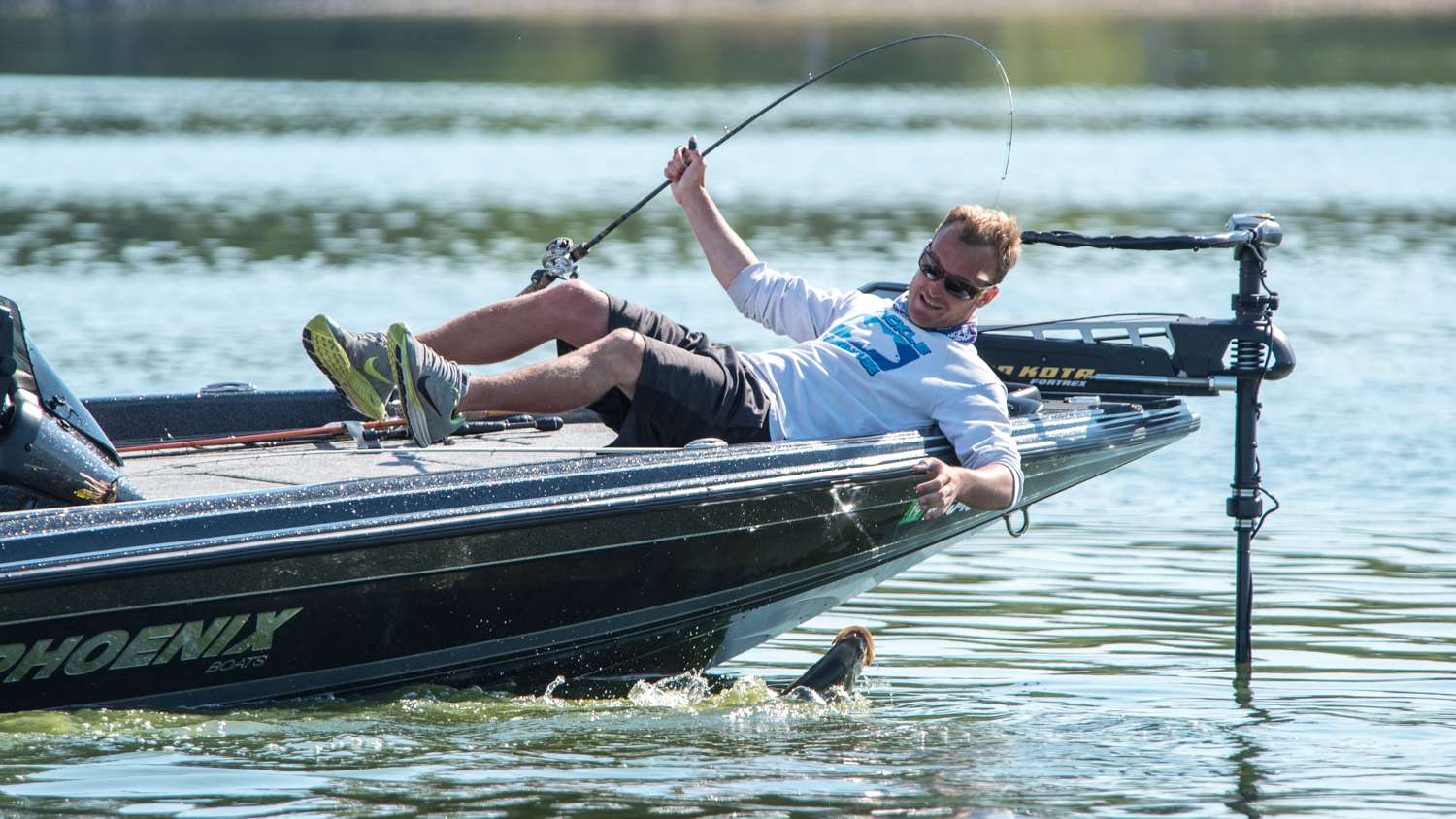 The fish dances along the surface as Carnright goes low to land his catch. 