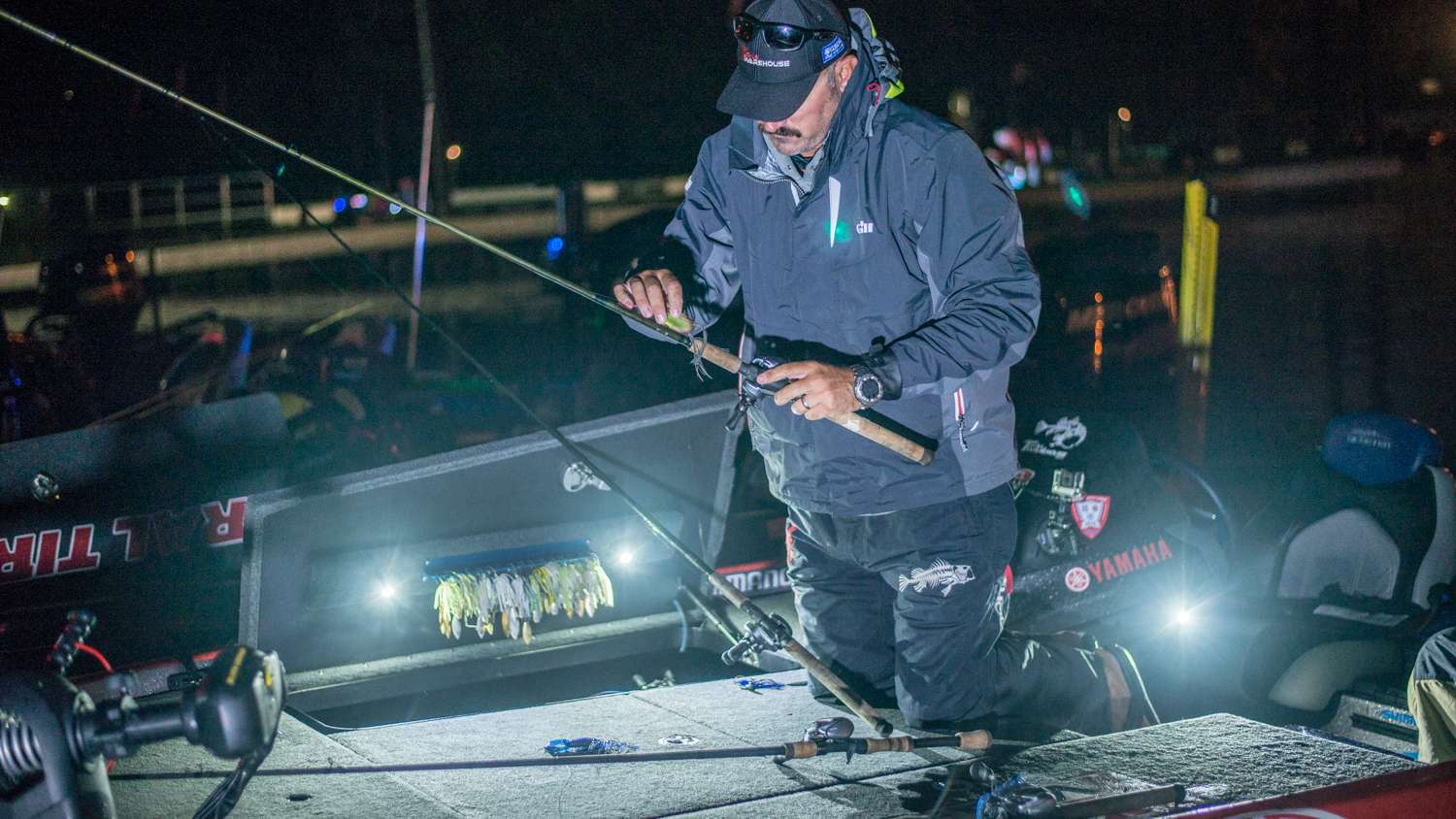 Lintner hooks his bait to the rod and spins his line around the rod to keep everything neat. 
