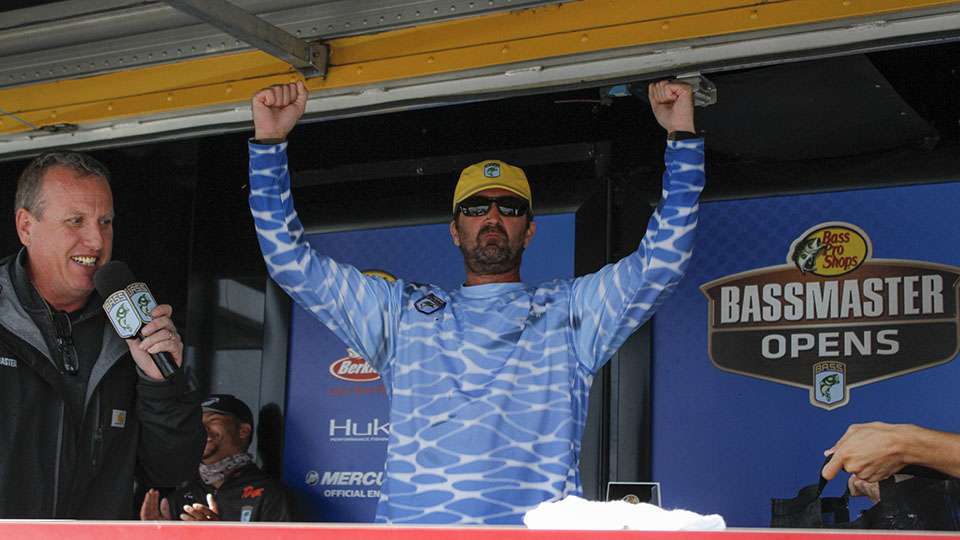 Eric Stecker is the last co-angler to weigh and his three-fish limit for 12 pounds gets it done.