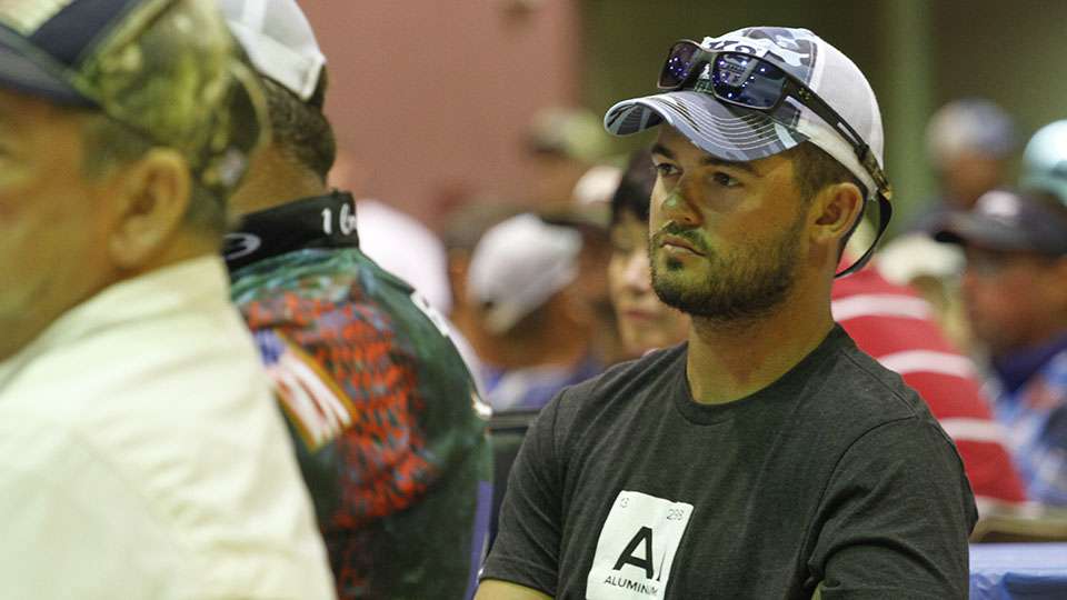 As Skylar Hamilton, champion of the first Central Open on the Arkansas River listens intently.