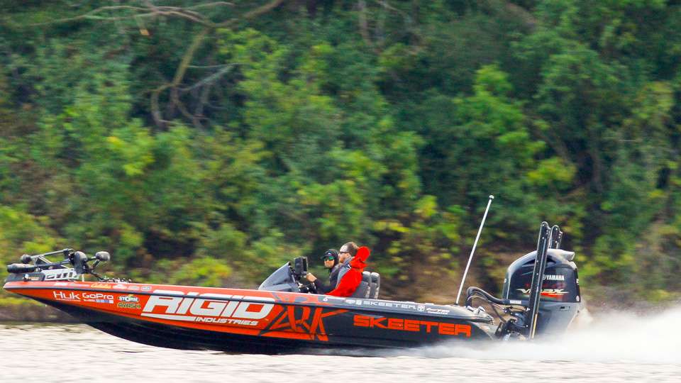 Brandon Palaniuk sped by and took a look at the pair as he headed up river.