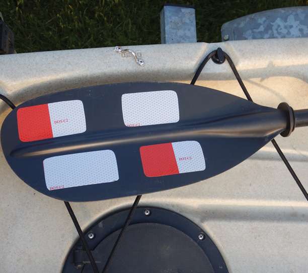 Tape on a paddle blade will help get the paddle seen both by reflecting bright sun and nighttime searchlights when waved in an emergency.