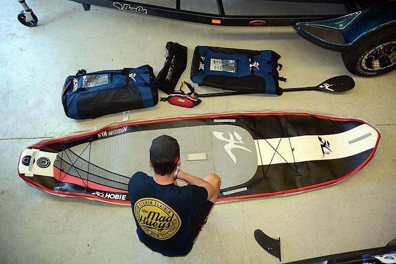 This Hobie Adventure 10.8 is an inflatable stand-up paddleboard. Carl and Kayla even transport them as checked baggage on commercial flights. The three-piece paddle and PFD are stowed inside the pack. When inflated the SUP measures 10 feet, 8 inches with a wide beam of 32 inches, about the same width of a Hobie sit-on-top fishing kayak. 
