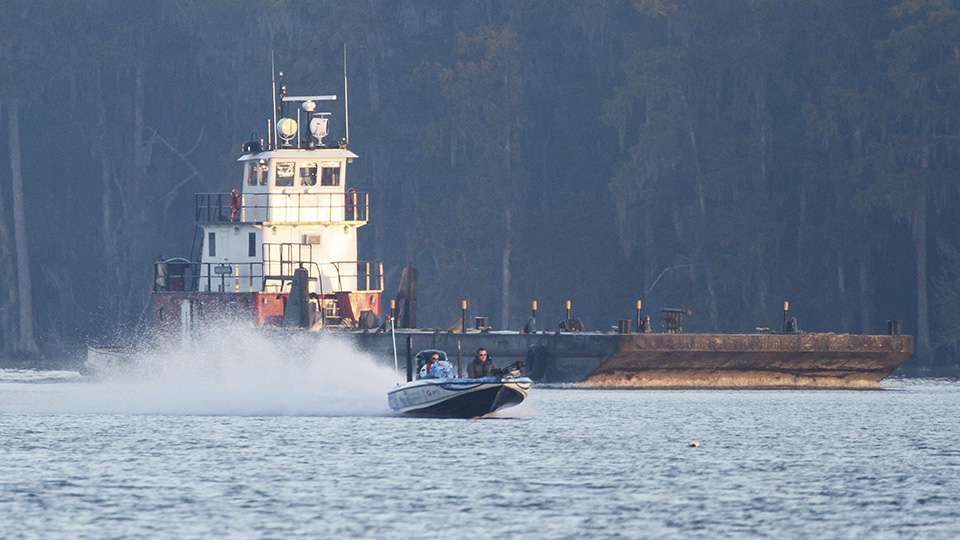 Another angler screams down the Basin and passes one of the many tug boats that go up and down the river.