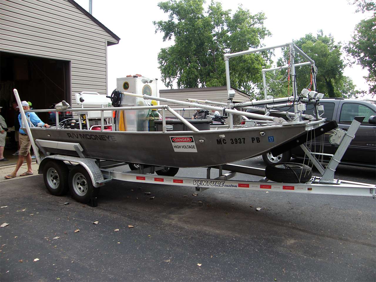 The Michigan DNR shows off the electric shock research boat, the R/V Mooneye.