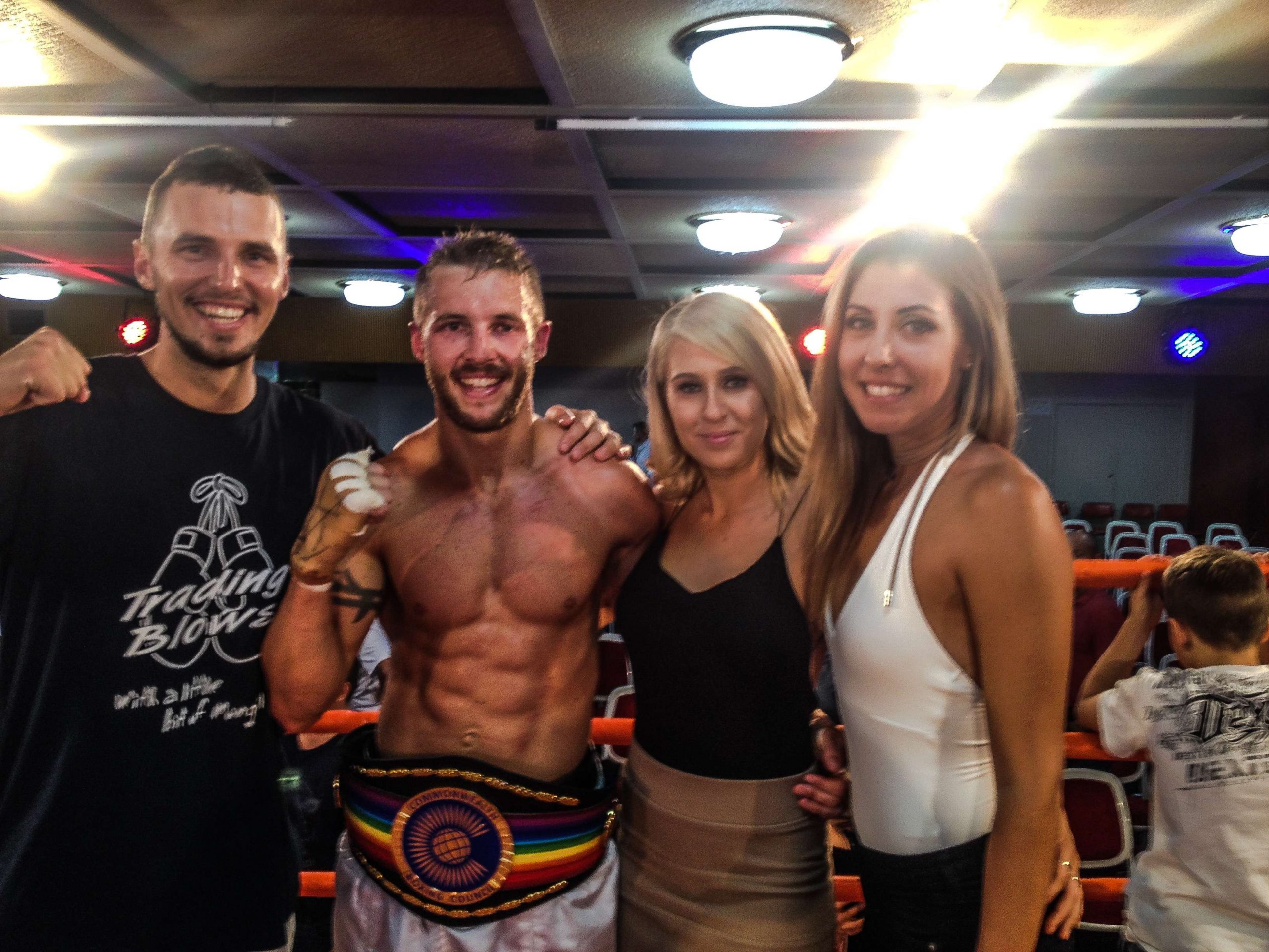 Carl Jocumsen poses with his cousin, Kris George. George is the Commonwealth Boxing Council welterweight champion. The cousinâs girlfriends join them, including Kayla Palaniuk. 