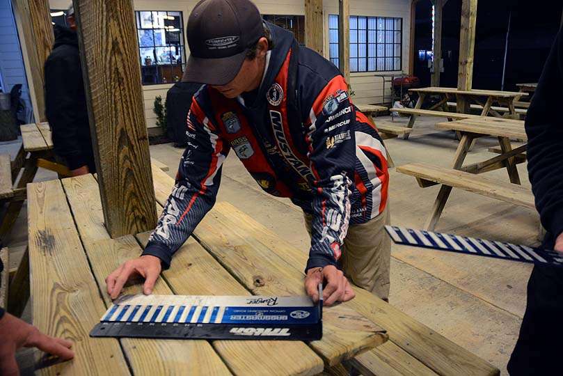Greg Vance of Iowa makes sure his measuring board meets the same exact measurements as the official version used by B.A.S.S. 