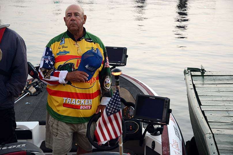 Paying honor to the flag he served in the military is Kurt Glass, the Paralyzed Veterans of America Angler of the Year. 