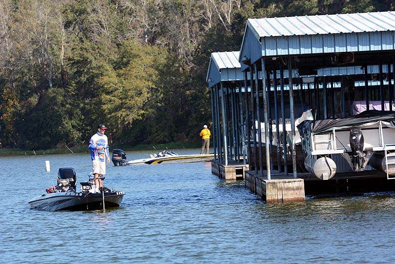 The anglers move to a point for better action near a marina. Fishing that is Darrell Ocamica of Idaho with non-boater partner Larry Will of Virginia. 