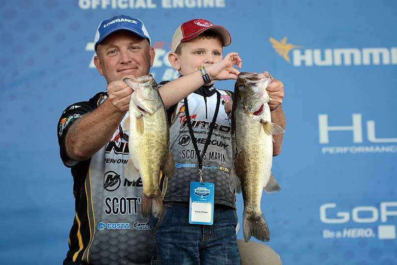 Danny Grantham of Alabama poses with his son, Liam. Grantham is eighth place in the tournament. 
