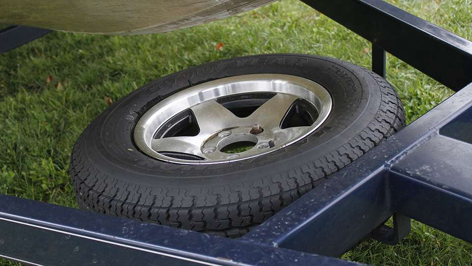 He keeps a spare trailer tire under the bow of his boat.
