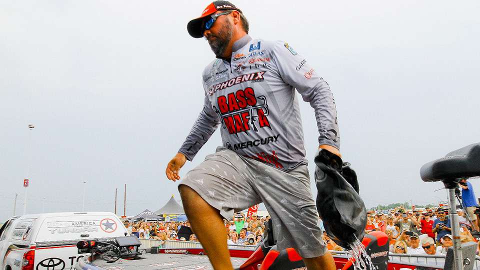Greg Hackney brings his bag of fish to the scales during the final weigh in at BASSfest on Lake Texoma. 