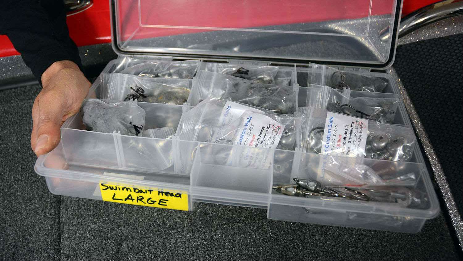 Call this organization within organization. Lucas stores swimbait heads inside plastic bags according to weight. Those can easily look identical and searching randomly inside a box of leadheads for the right size is too time consuming on the water. 
