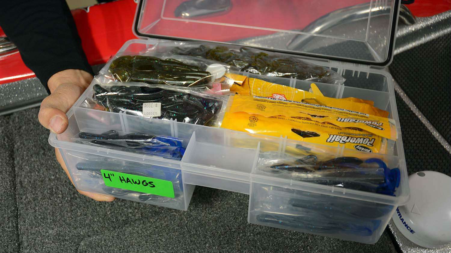 A look inside the Hawgs box reveals baits are even organized by size, too. Soft plastic lures of the same shape and color are easy to misidentify. Labeling the box with lure length eliminates the confusion. 
