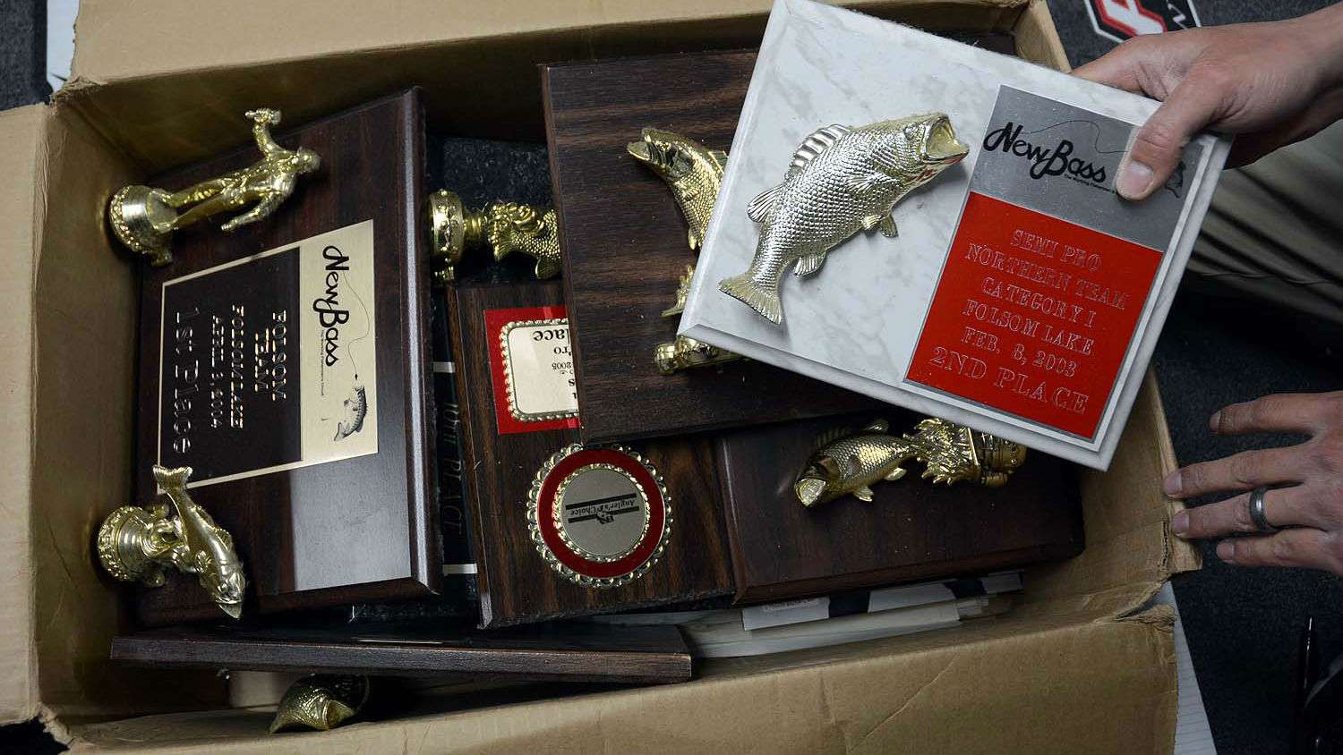 The box filled with trophies traces Lucasâ tournament success back to his native California. 